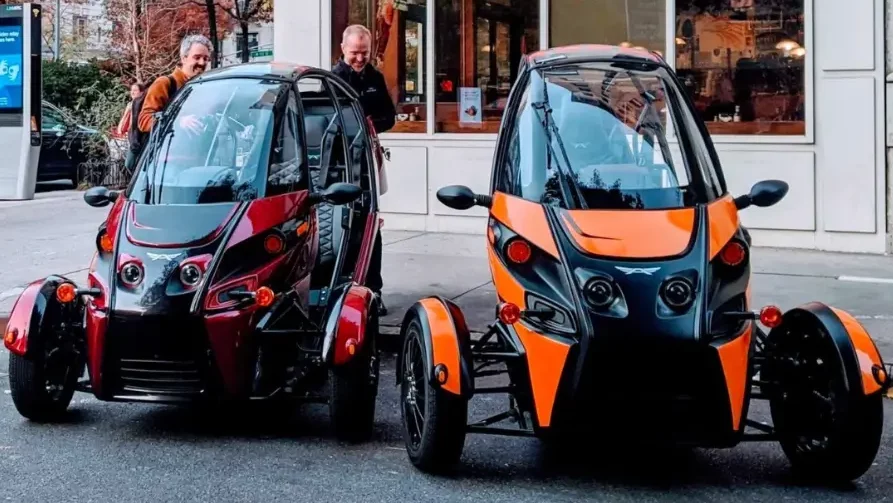 Arcimoto electric vehicles parked in the city - unknown car brands
