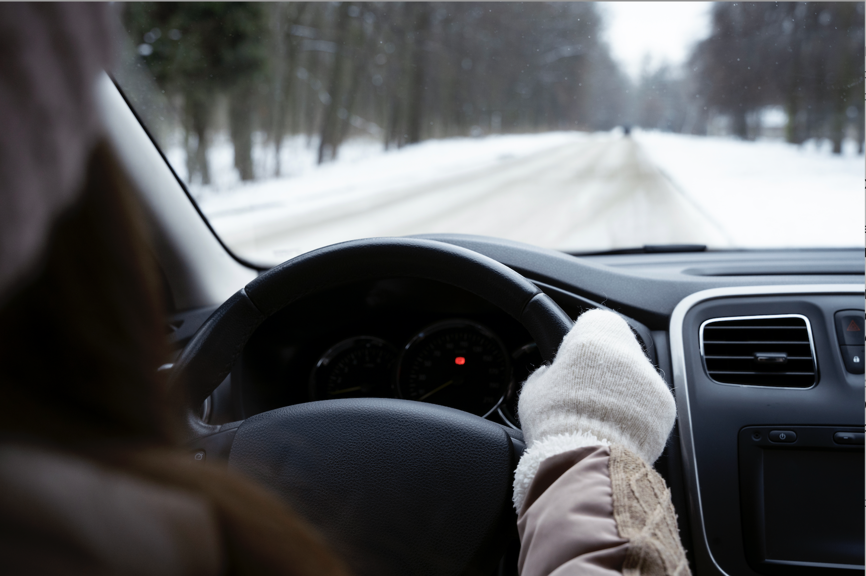 Women driving in winter weather